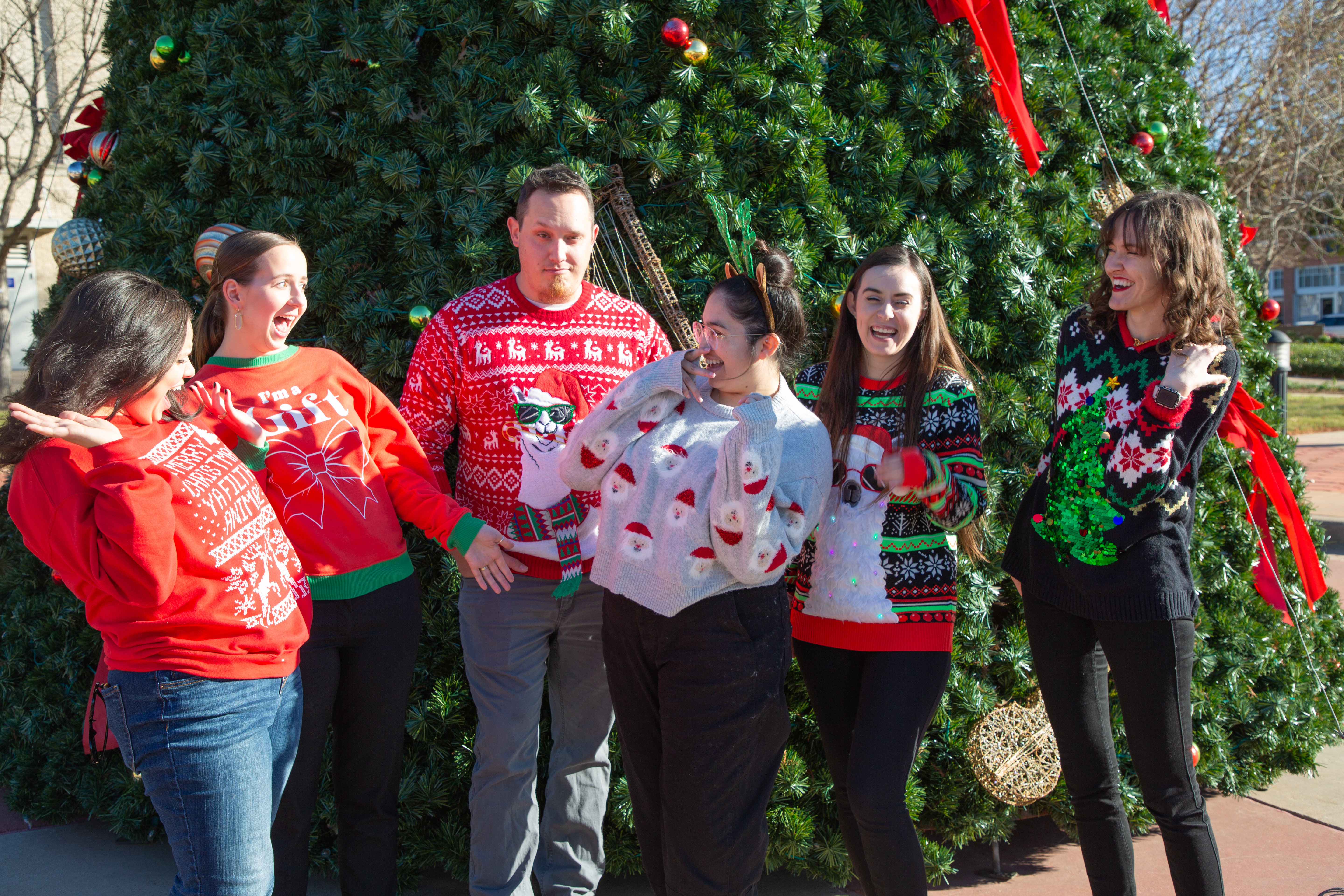 First Friday Kringle Krawl group in festive Christmas Sweaters
