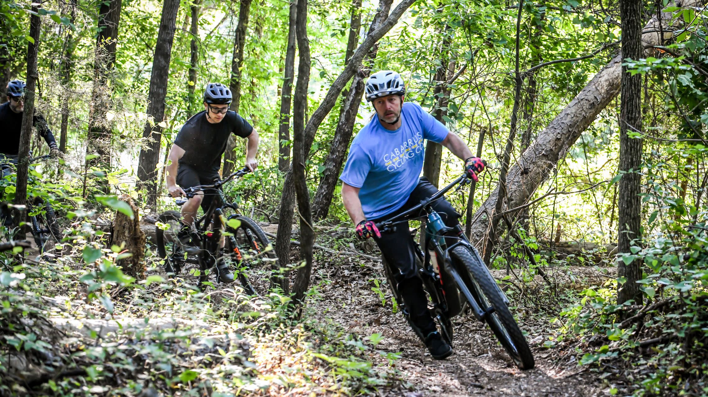 mountain bikers riding on trail