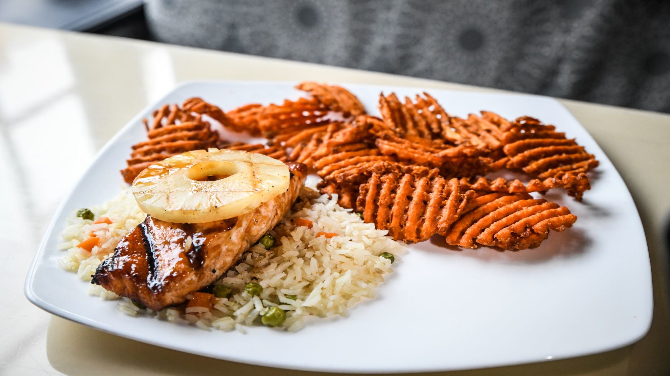 entree dish with chicken and pineapple on top