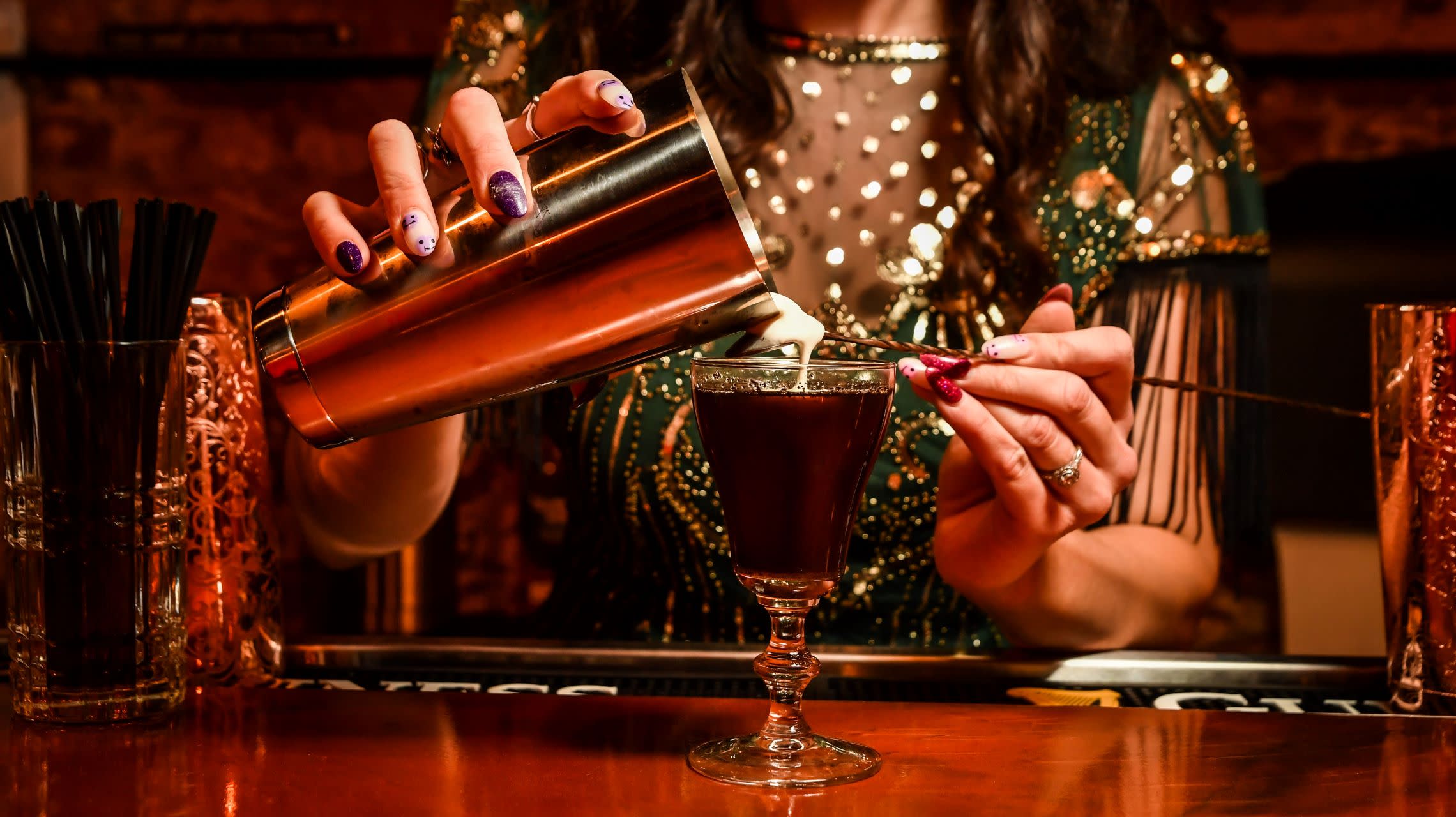 bartender pouring cocktail