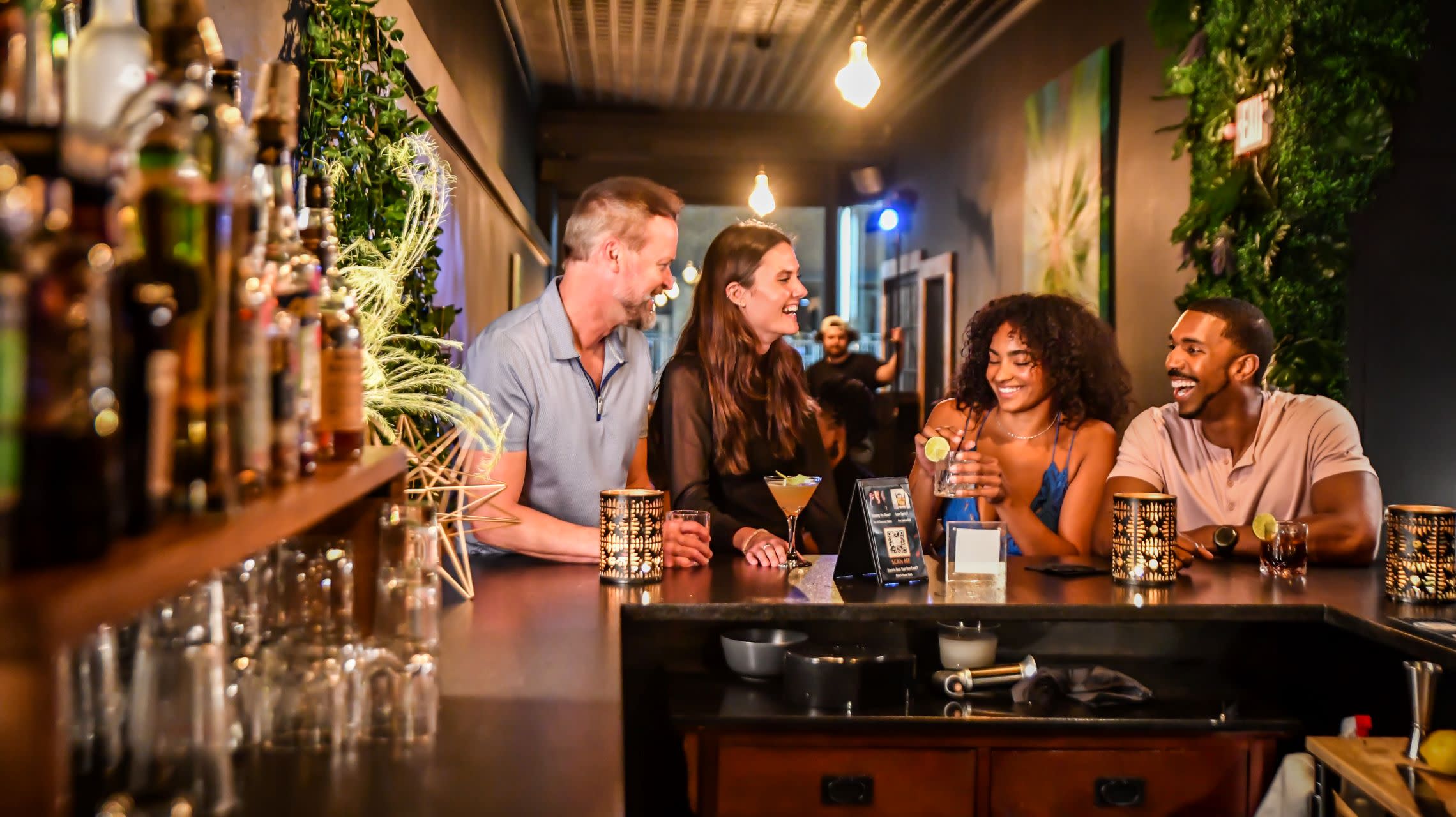 friends enjoying a drink at the bar