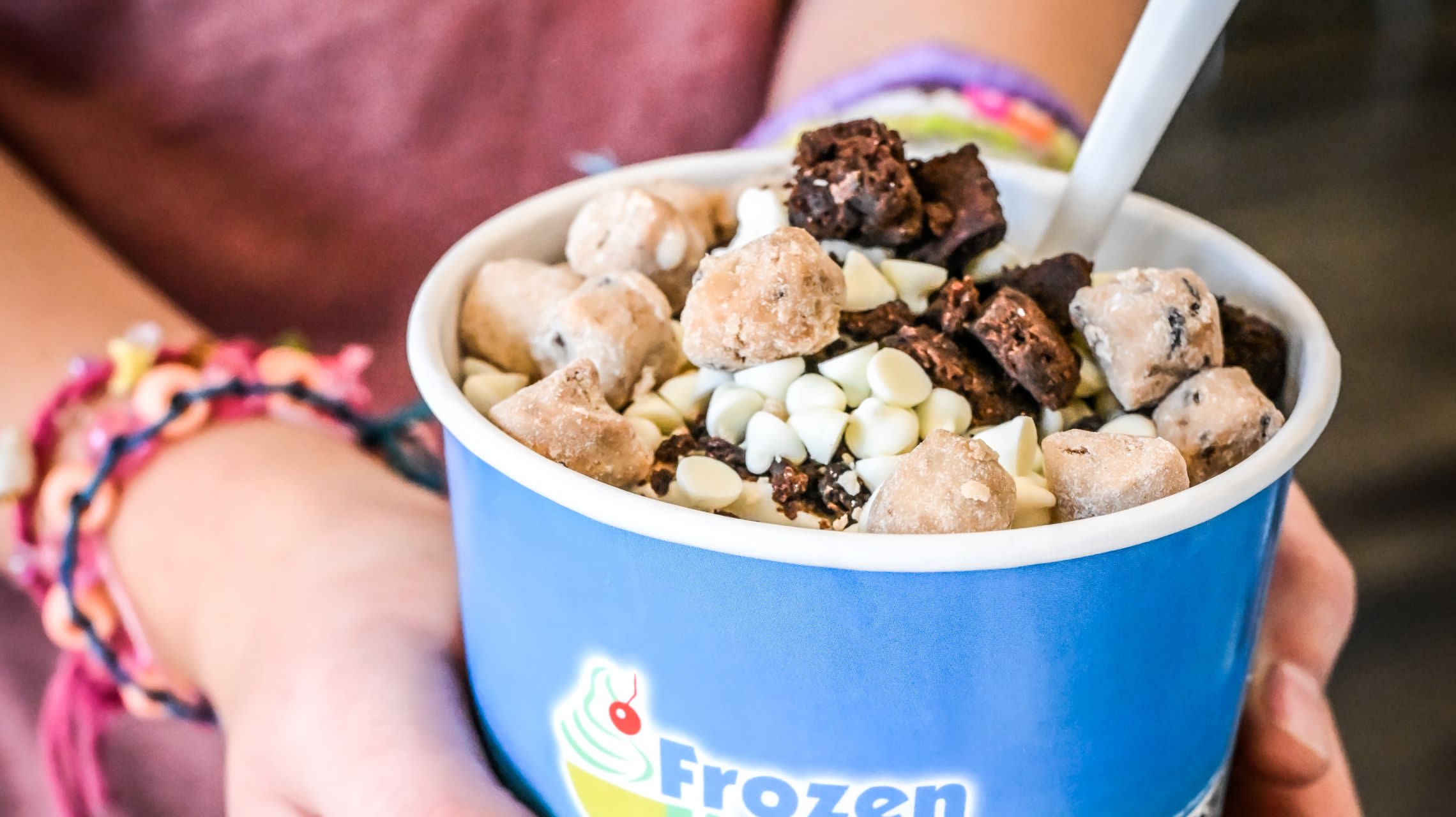 girl holding frozen yogurt