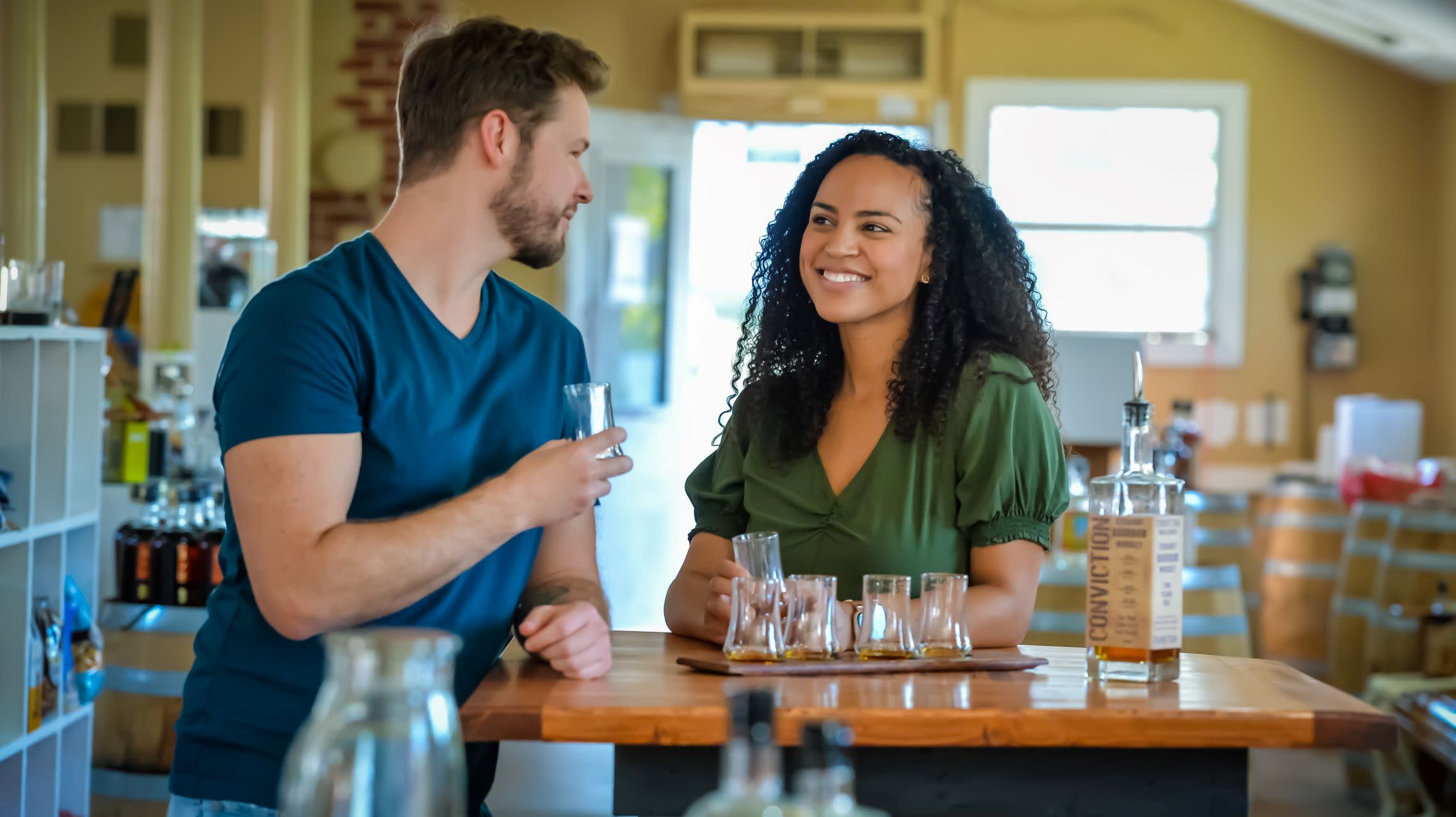 couple during whiskey tasting at distillery