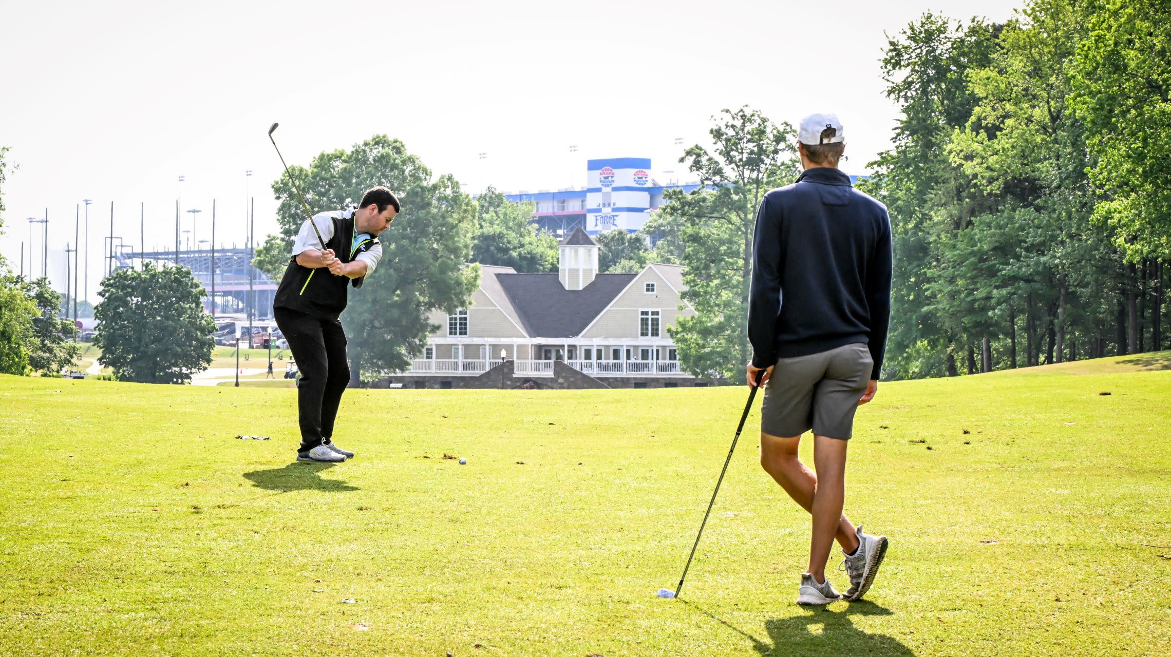 two men golfing