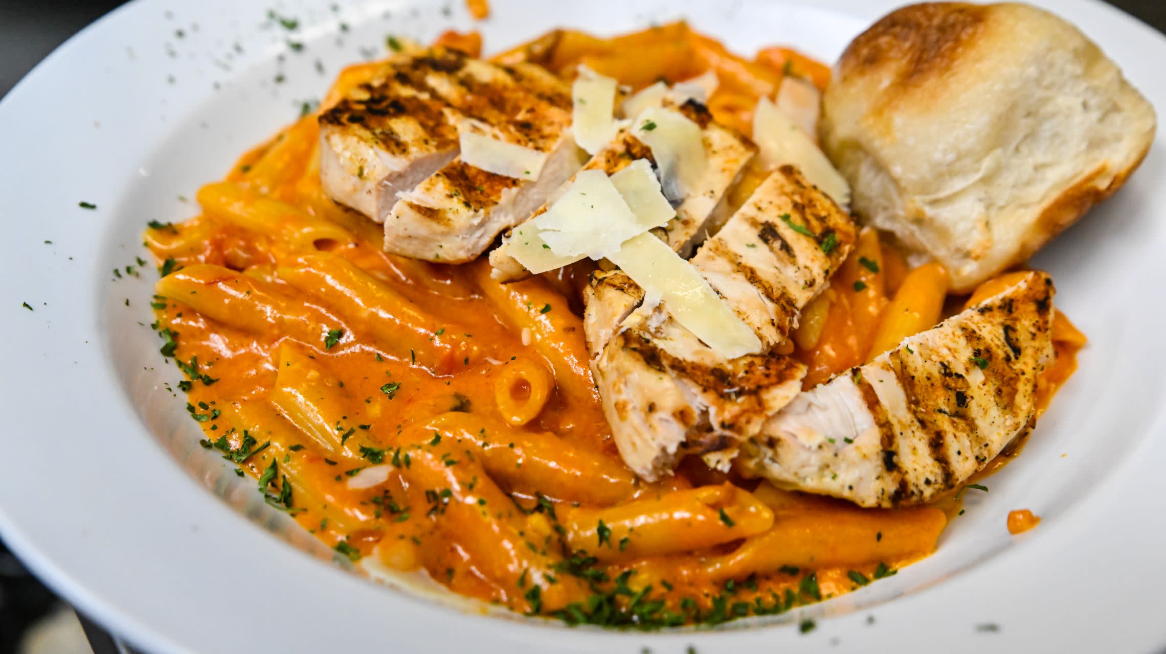 plate of pasta with bread