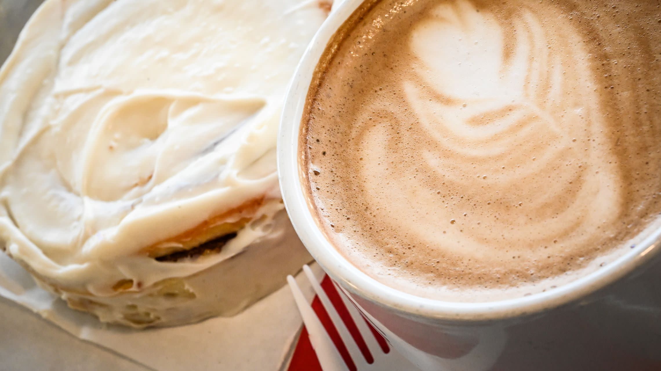 cup of coffee and cinnamon roll