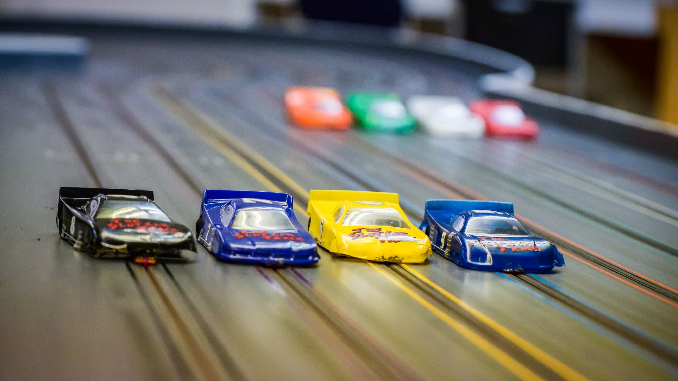 slot cars lined up on track