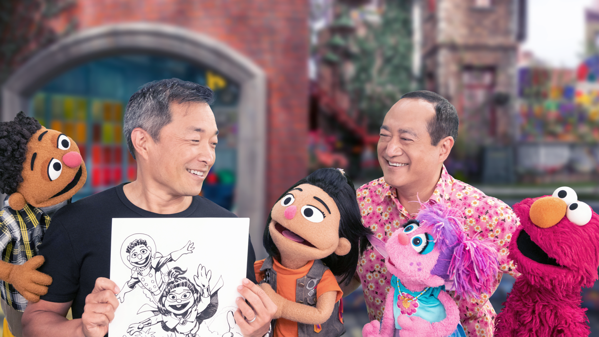 Sesame Street celebrates Asian American and Pacific Islander culture with artist Jim Lee (left), new Muppet Ji-Young (center), and Sesame Street actor/director Alan Muraoka (right).