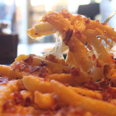 Loaded Fries with cheese and bacon.
