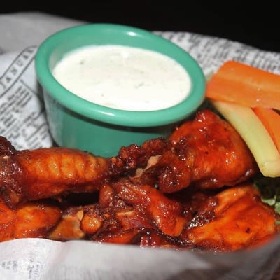 Buffalo Wings with veggies and dip.
