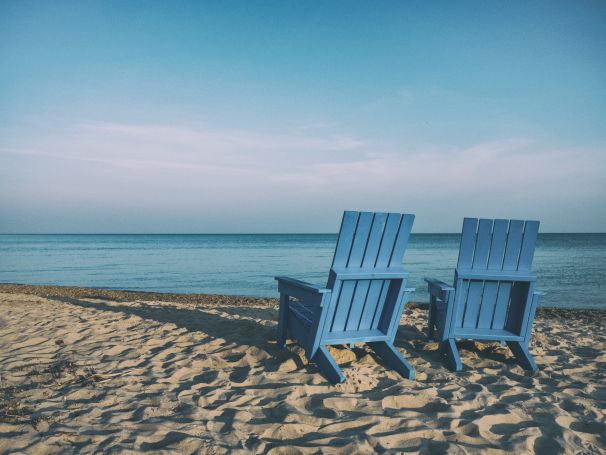 deck chairs on an empty beach deck chairs on an empty beach