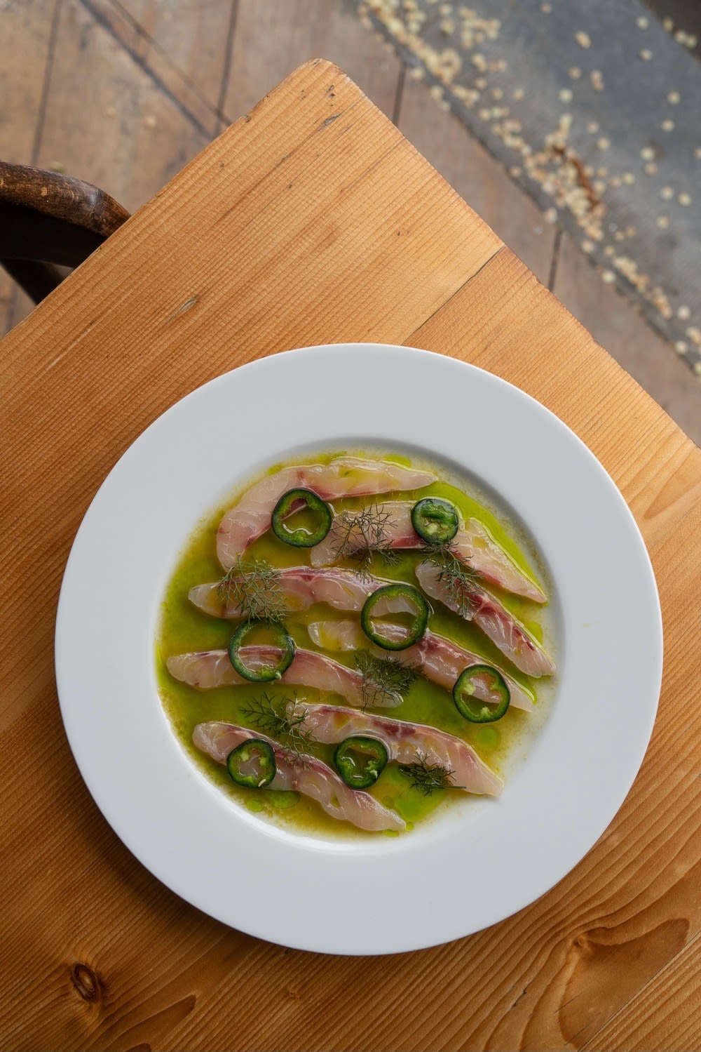 Amsterdam restaurant Binnenvisser shows seafood fish dish with seasonal ingredients