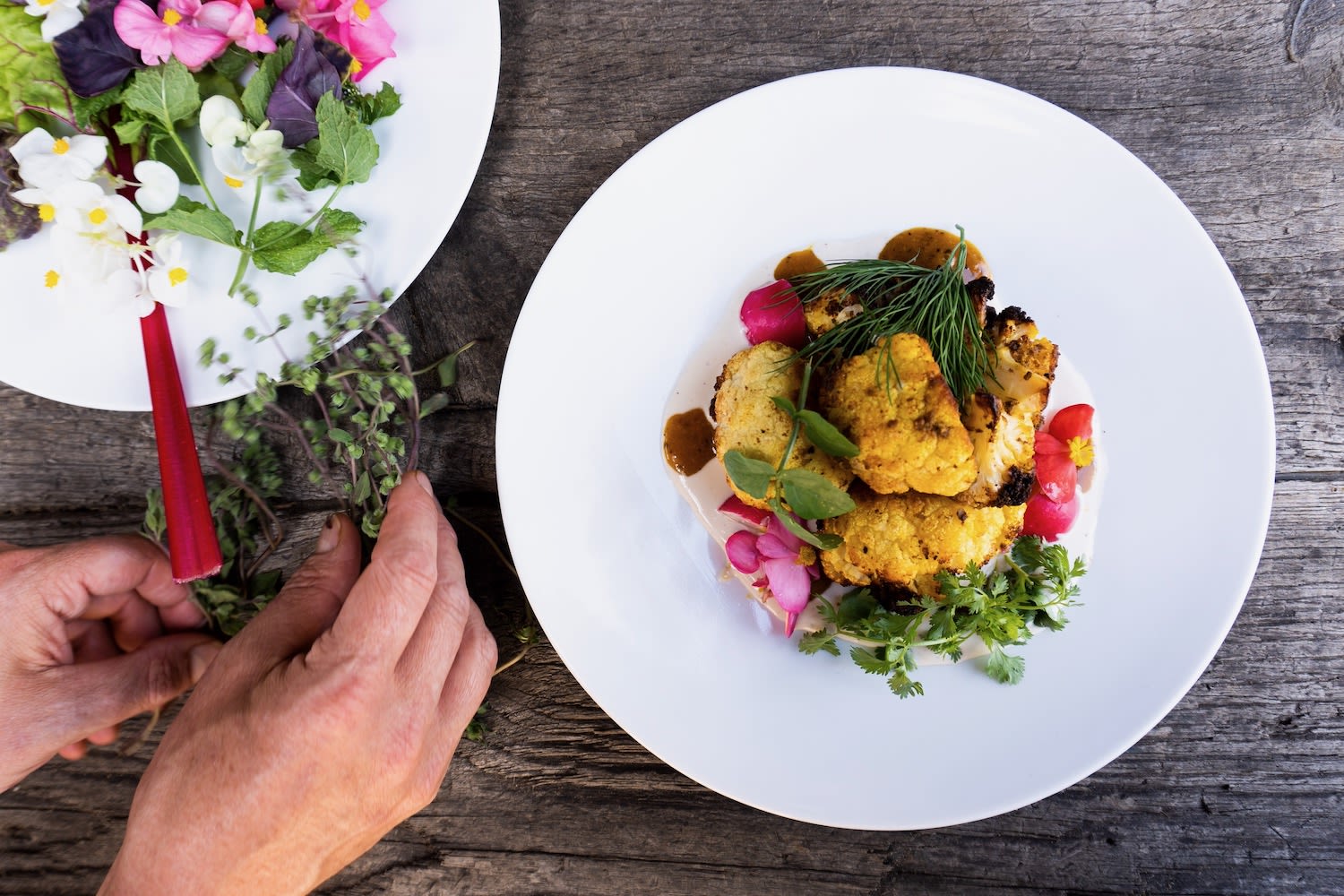 Sustainable Amsterdam restaurant Café de Ceuvel prepares vegetarian meals of cauliflower and greens