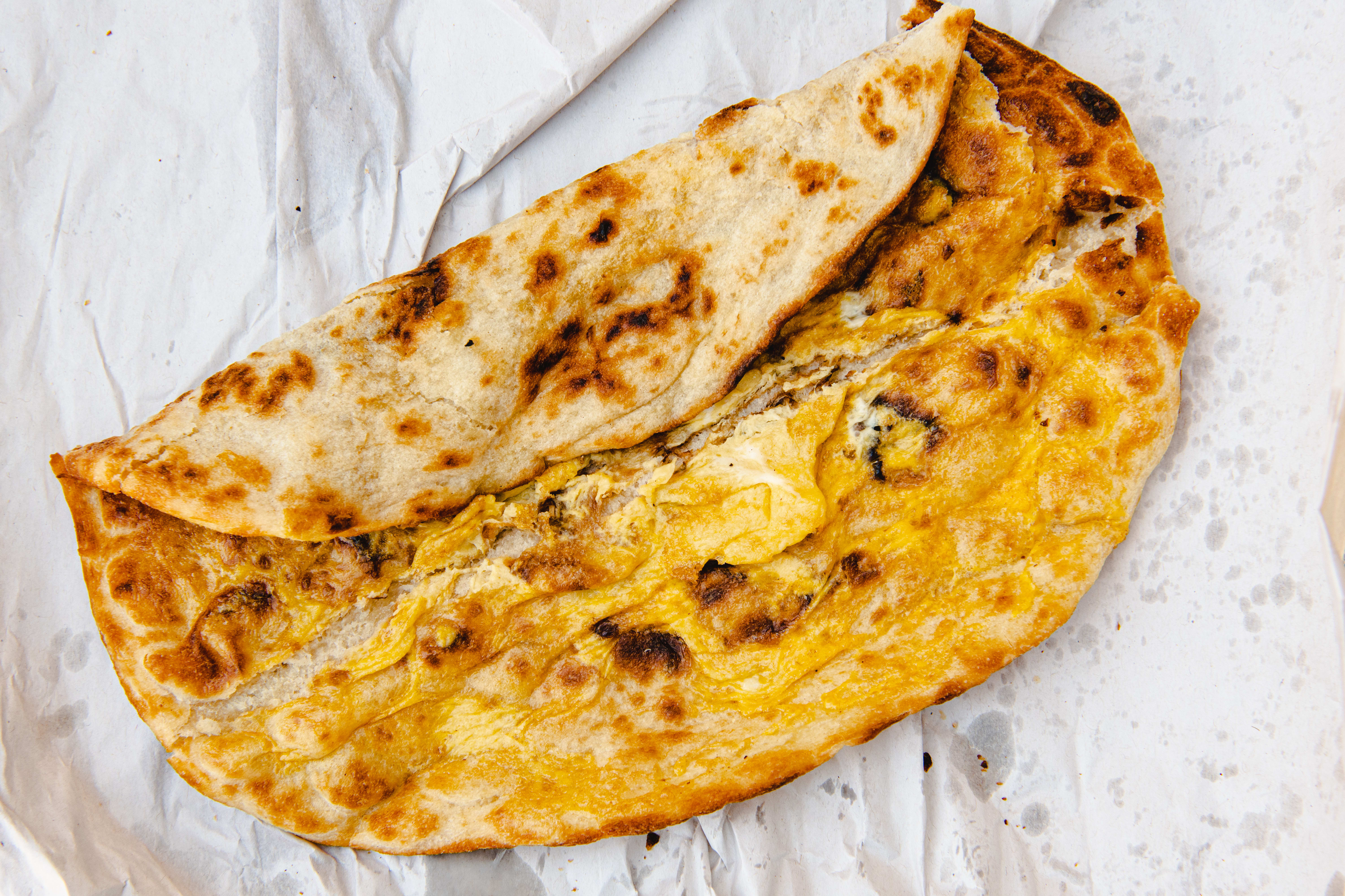 Naan Indian Bread Hand Made and Cooked in a Clay Oven in Old Spiltafields  Market, London 