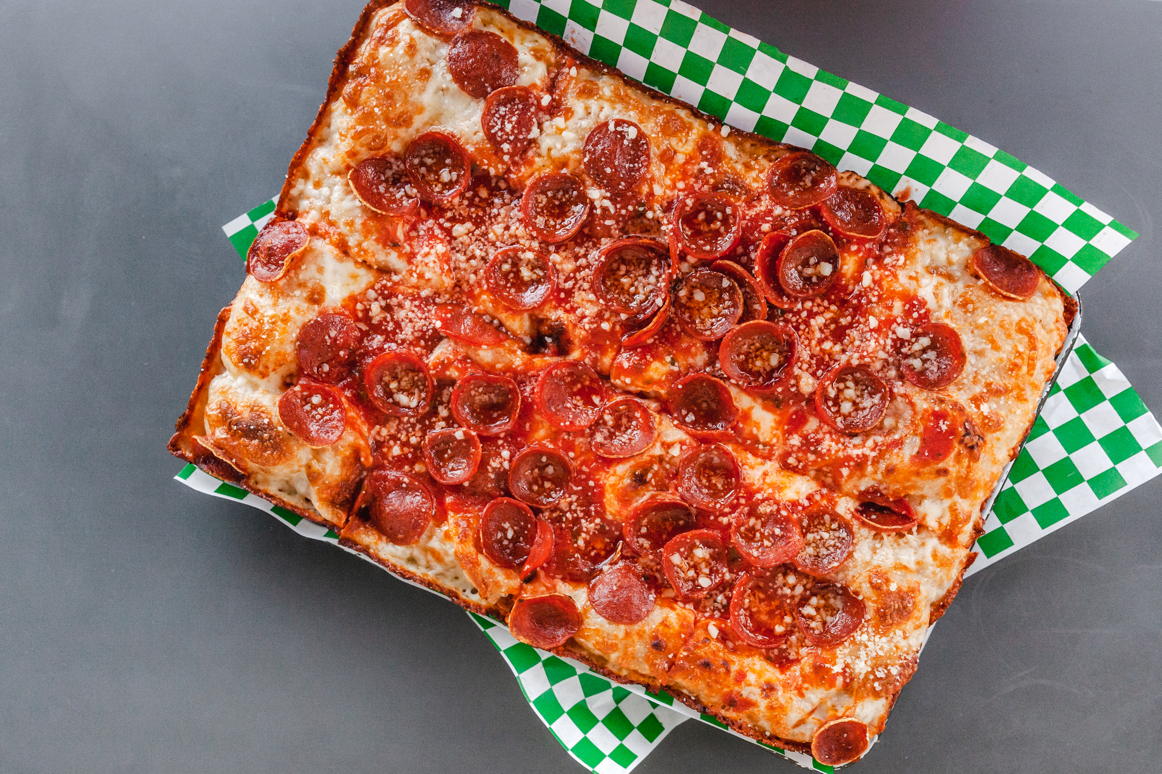 4 Reasons You and Your Friends Should Enjoy a Slice of Pizza — Top in Town  Pizza