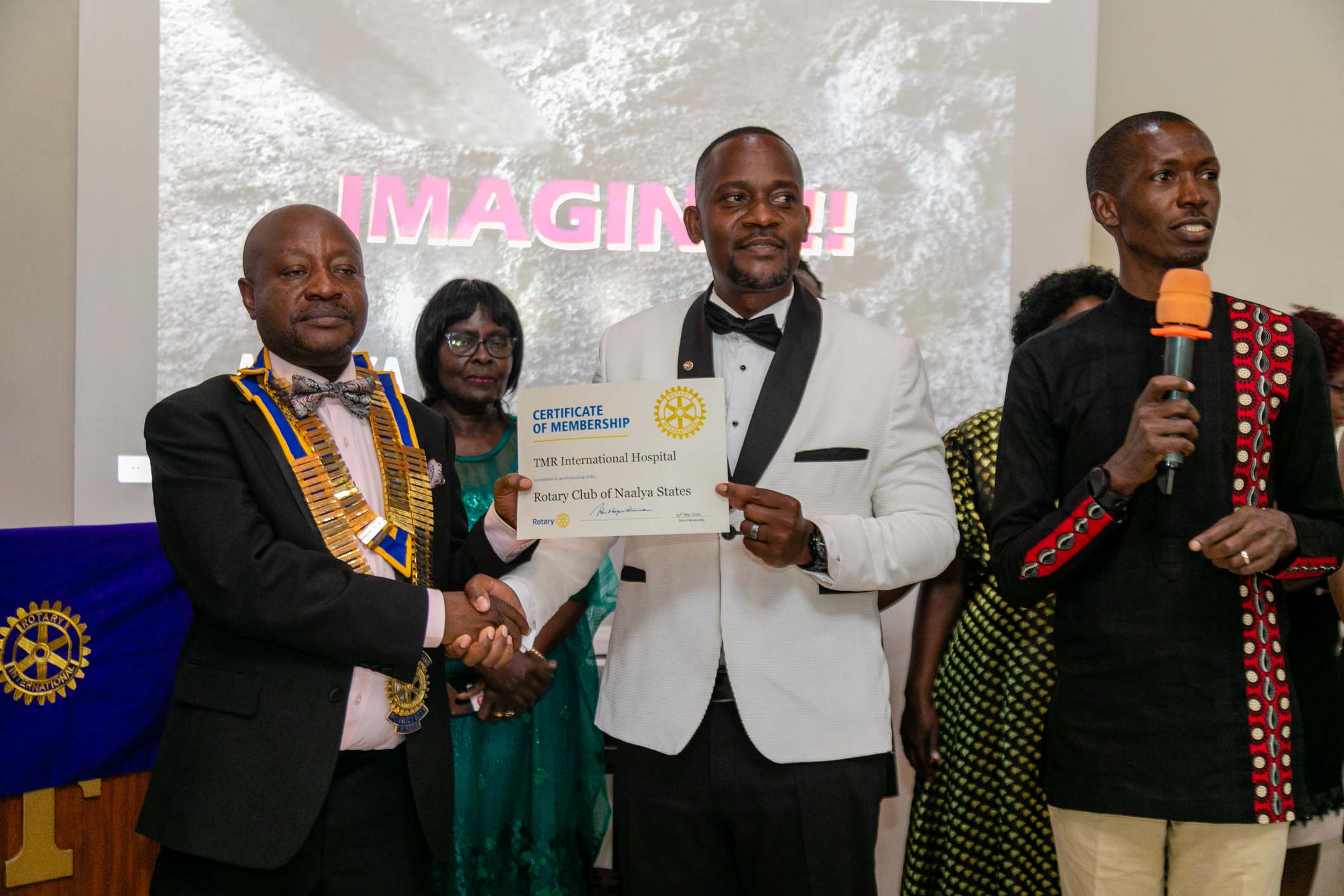 Our Executive Director, Dr. Daniel M. Talemwa receives a certificate officially recognizing TMR International Hospital as a Corporate Member of the Rotary Club of Naalya States.    