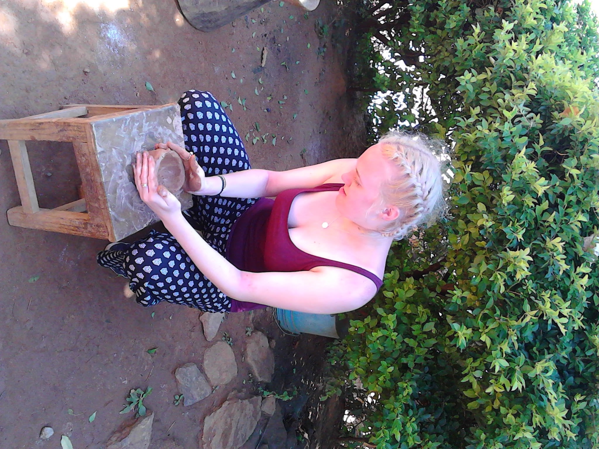 Travellers trying a hand at pot making 