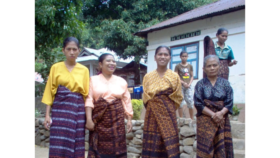Weavers in traditional dress