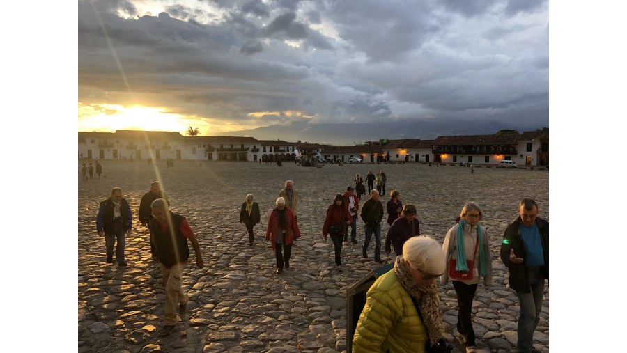 Travelers enjoying a sunset city tour.