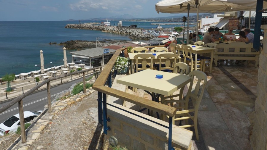 Have food in one of the cafes overlooking the sea