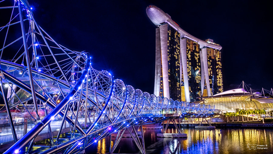 Cross the stunning Helix Bridge in Singapore