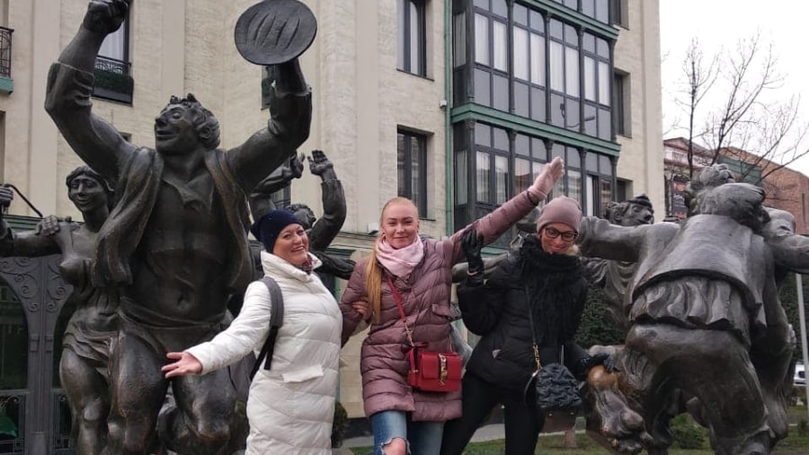 Posing with statues in Tbilisi