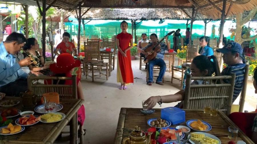 Tourist listening to Southern Vietnamese folk music