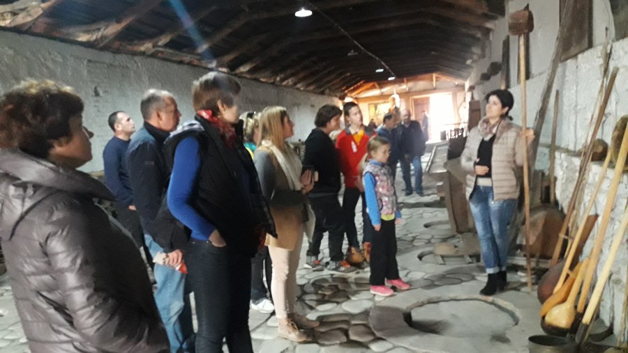 Tourists Learning How Wine Is Manufactured