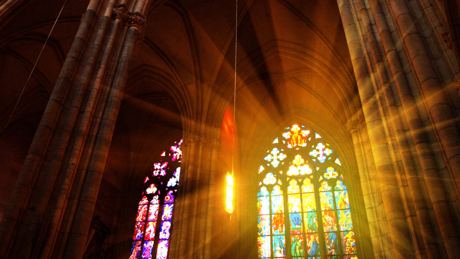 Light seeping through the beautiful colored glass inside of the Cathedral.