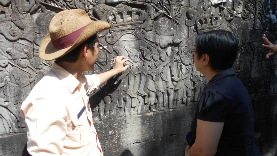 Explore the richly carved Bayon Temple in Angkor Wat