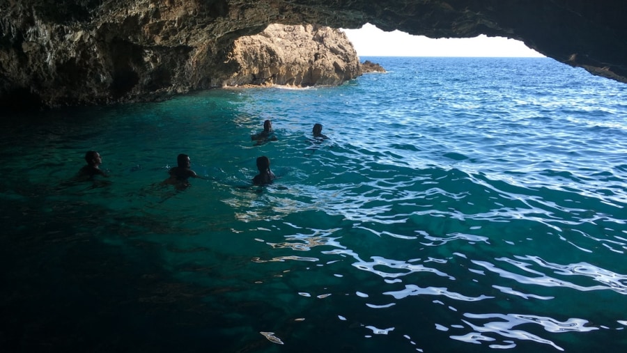 Swim inside the blue caves