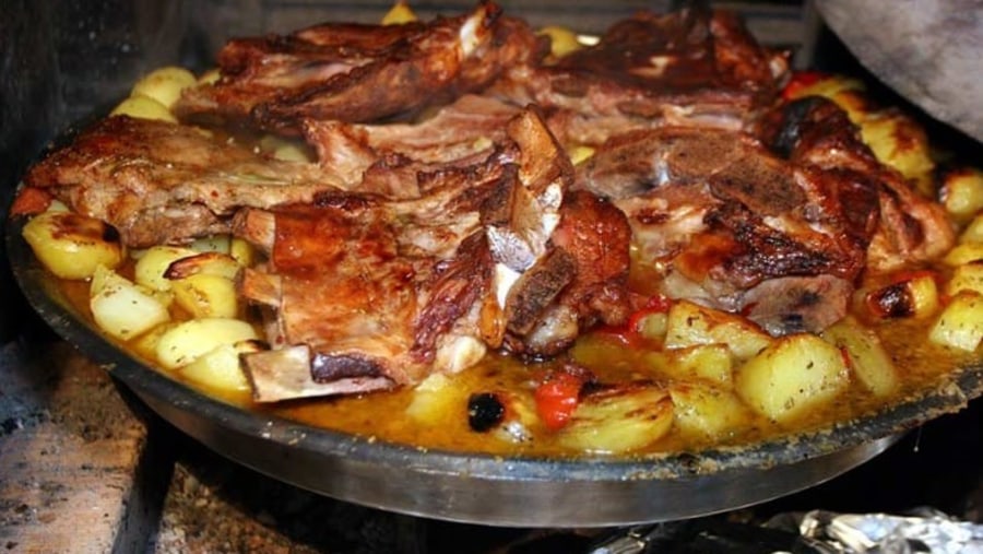 Meat and veggies prepared in Sač pot