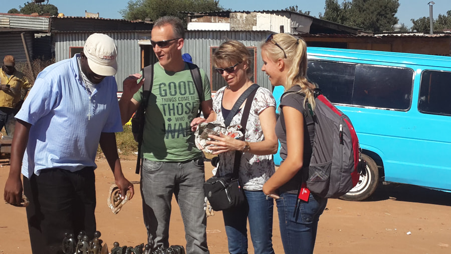 Tourists Interacting with the Guide at the Start of the Tour