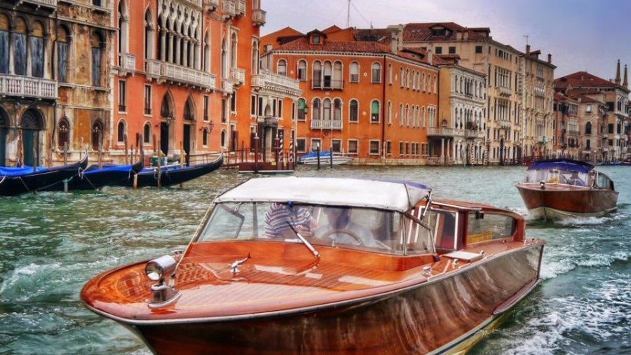 Enjoy the boat ride through Venice city while admiring the views