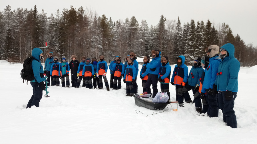 Ice fishing in lake Kitka, Kuusamo, Finland