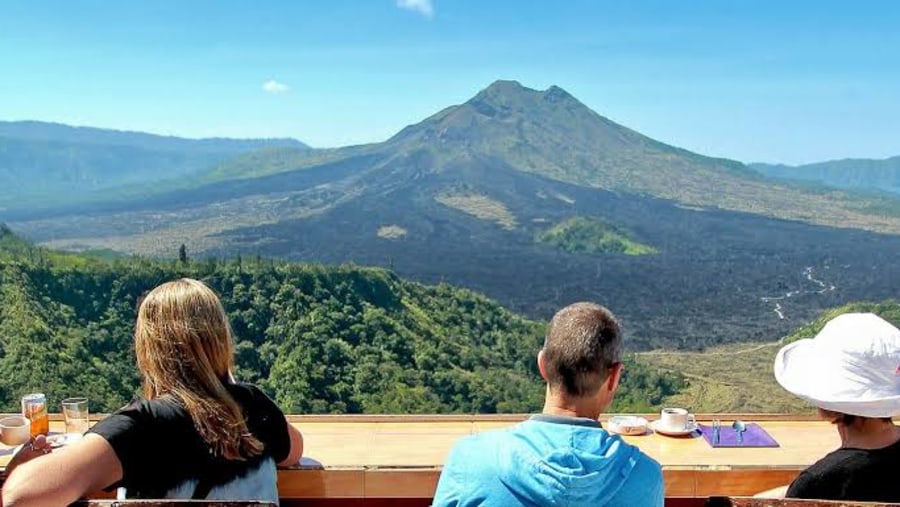 Happy tourists admiring the landscape views of Bali, Indonesia