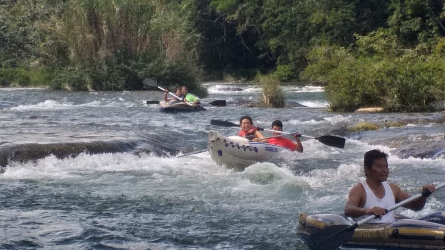 Kayak through River Rapids