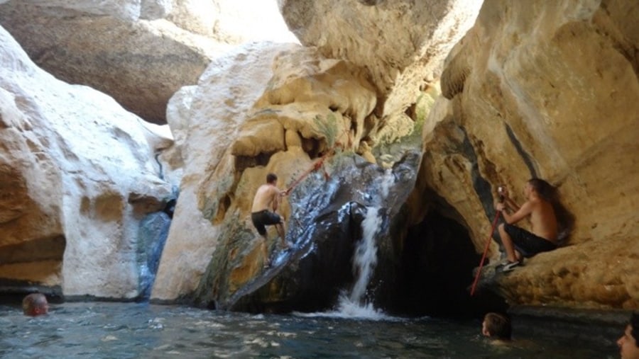 Climbing up the Waterfall in Wadi Shab