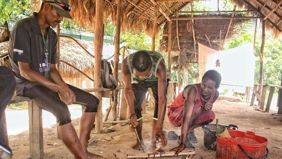 Cooking with members of Orang Asli tribe