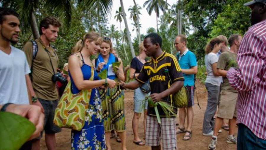 Tourists Trying The Spices At The Spice Farm