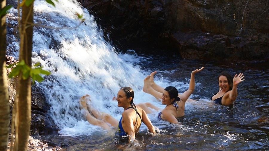 Tourists Bathing in The Berry Springs