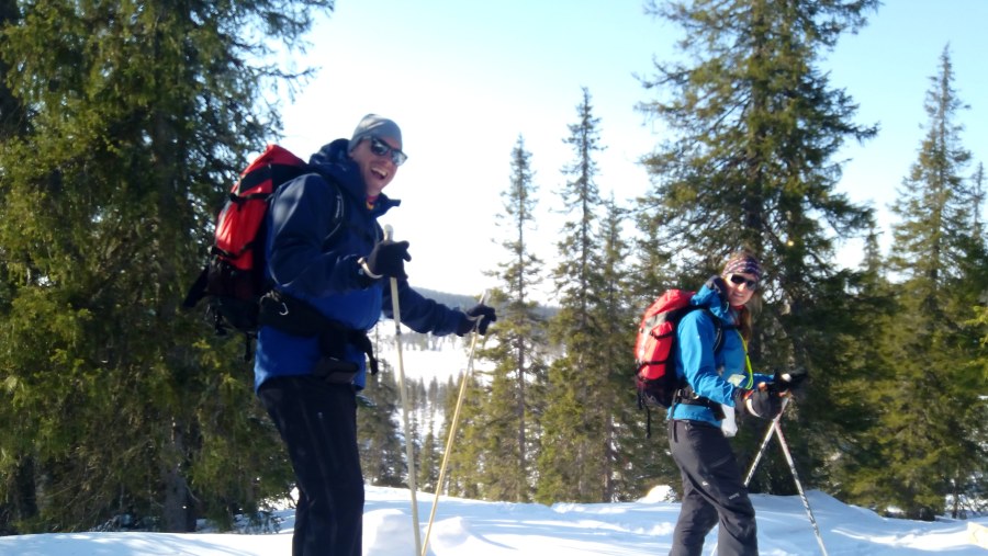 Happy tourists snowshoeing in Riisitunturi National Park