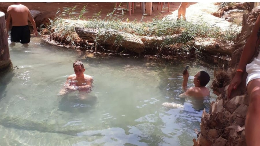 Travellers in a hot spring