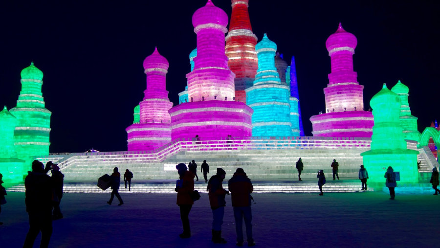 The ice sculptures light up in the night, leaving the spectators in an awe