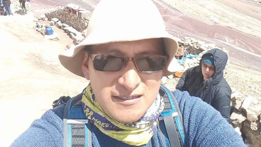 Tourists Climbing Vinicunca Mountain