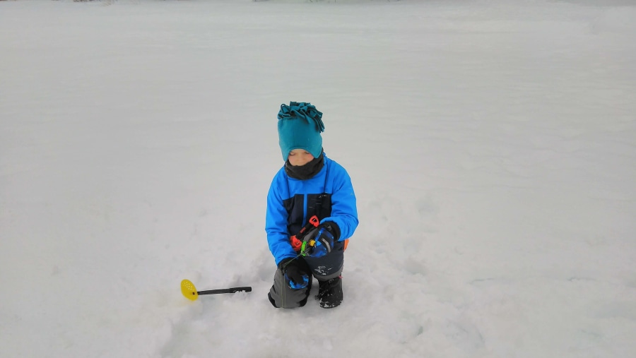 Ice fishing in lake Kitka, Kuusamo, Finland