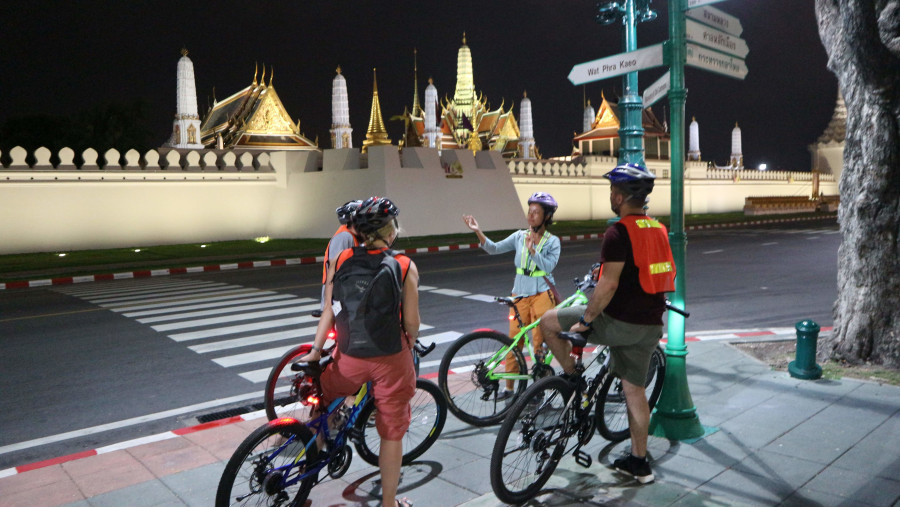 Listen to the Bangkok tour guide while on bicycle tour, Thailand