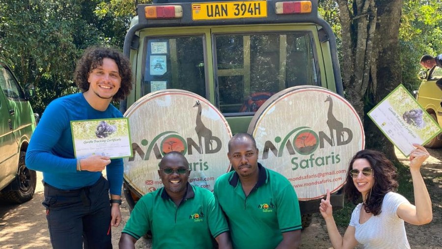 Travelers with their certificates from the safari