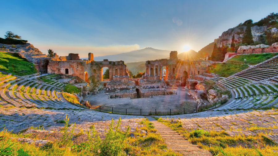 Ancient theatre of Taormina Siciliy Italy with Mt Etna - sunset views