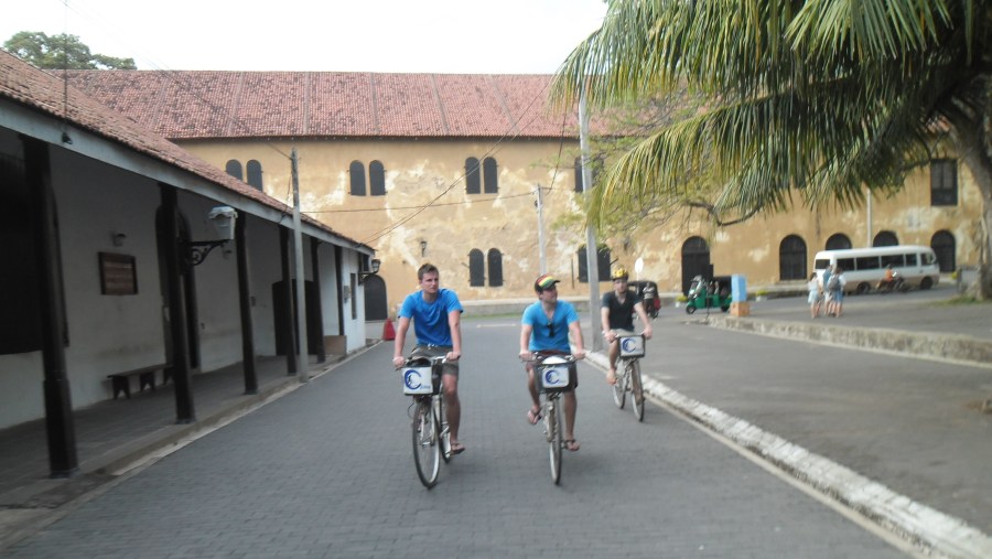 Tourists exploring areas in Galle on a bike.